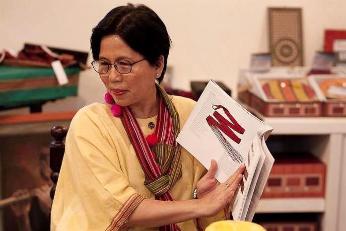 A woman teaching other women. 