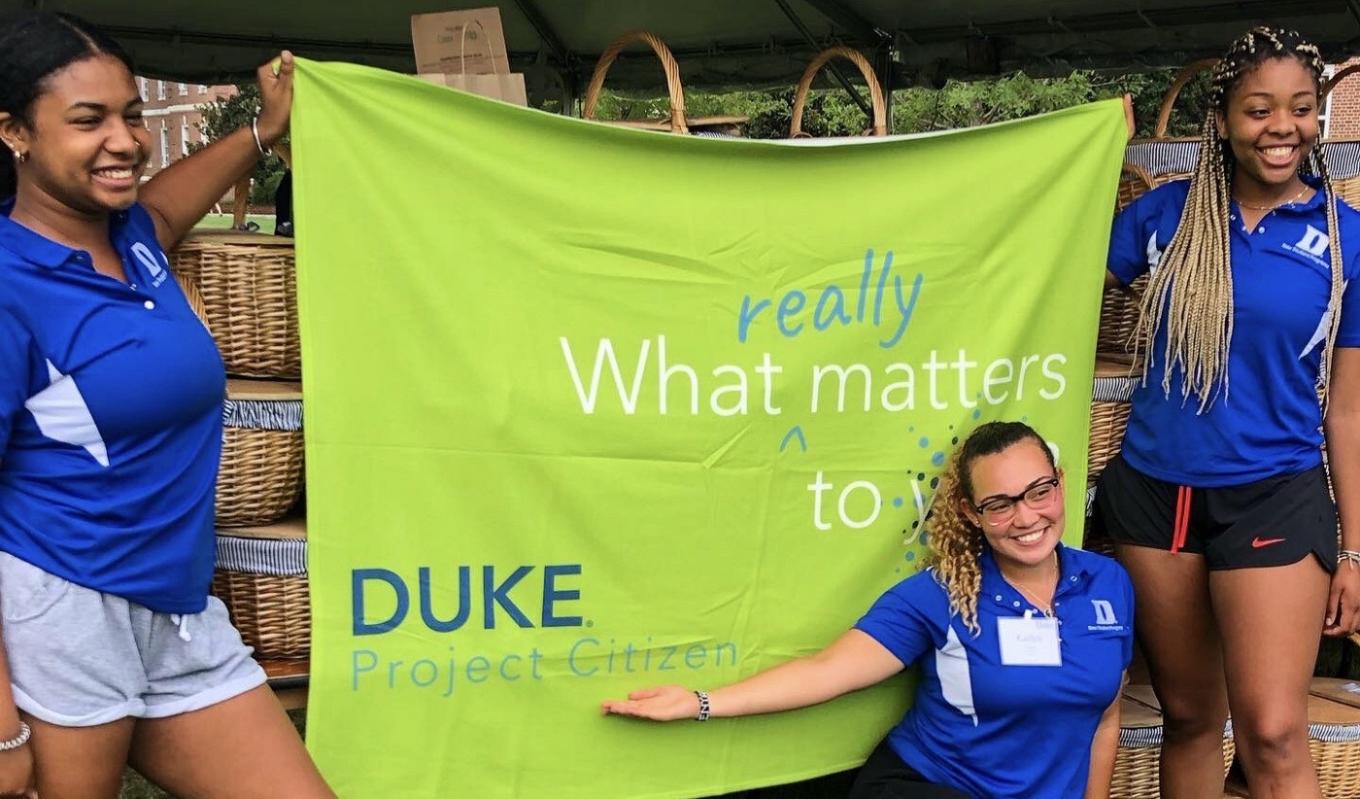 Team members of Working Across Differences promoting their initiative. 