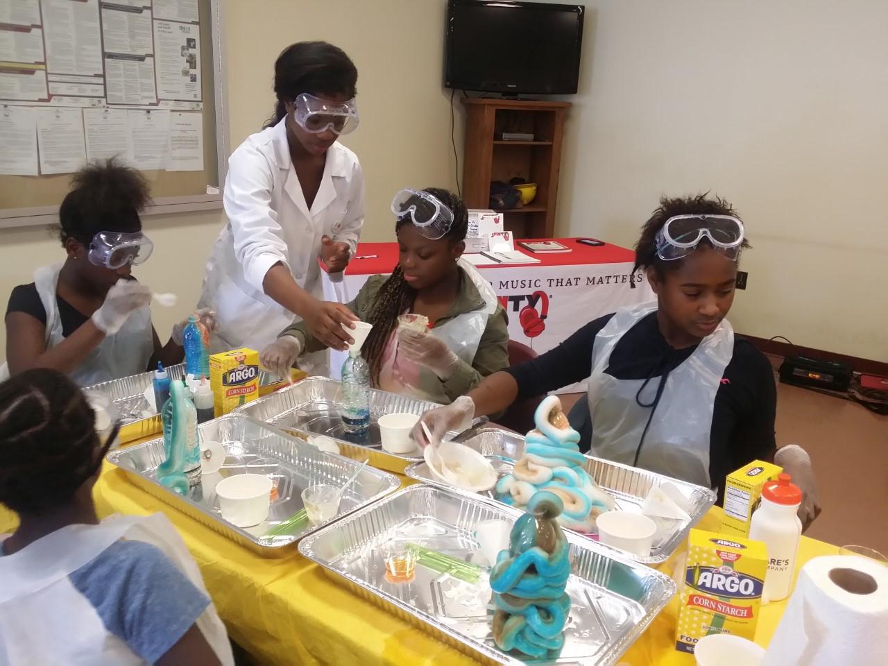 Jacqueline Means having experiments with young girls. 